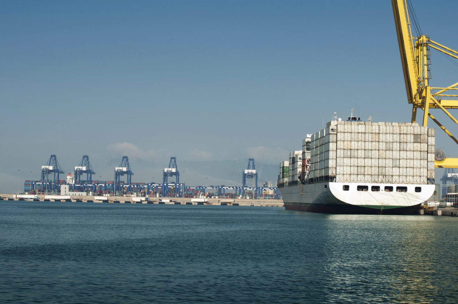 Freighter In Port Being Loaded With Containers